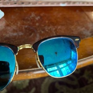 Blue lens ray Bans. Lens have some scratches. 2 black dots on it